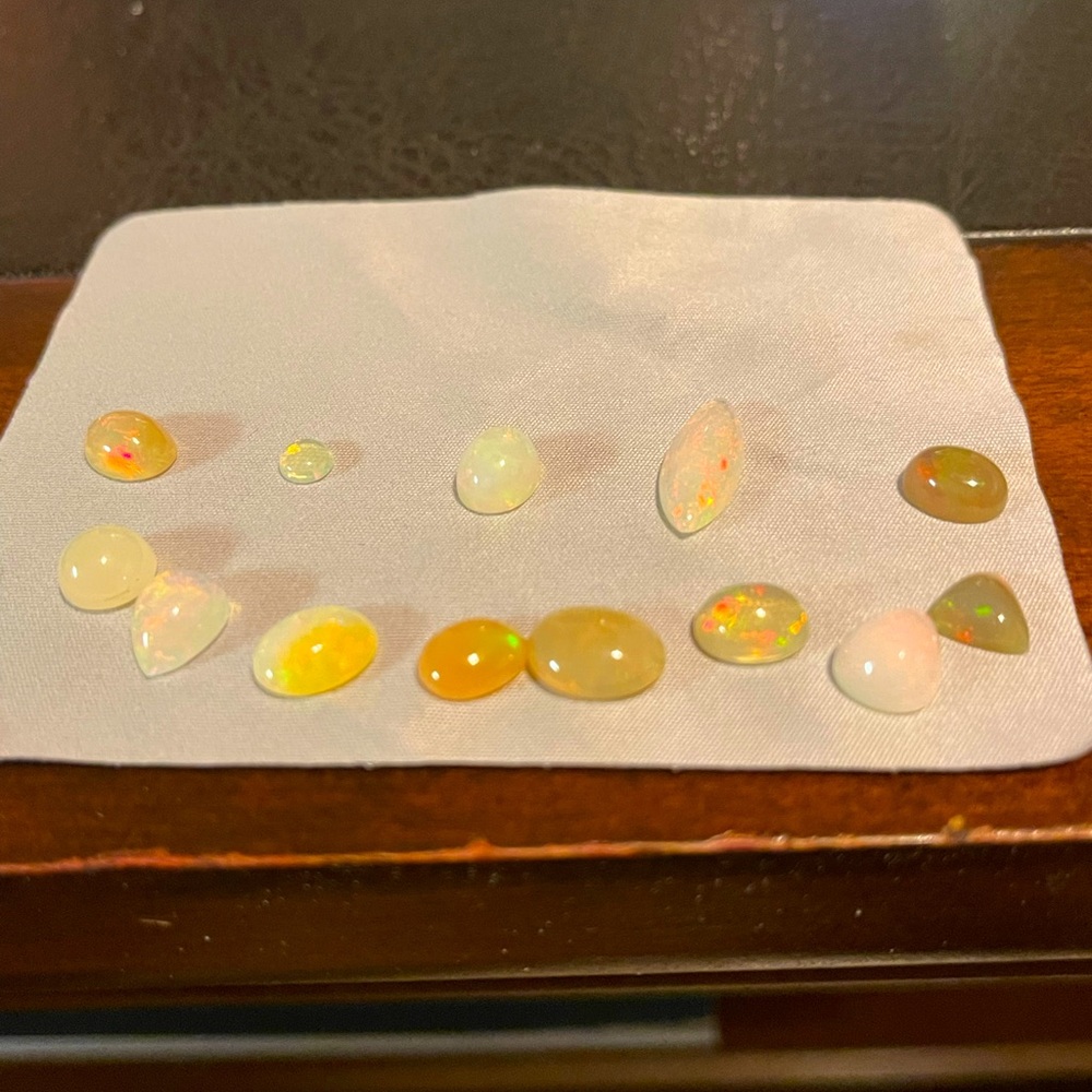 Loose Opals in different shapes and sizes equaling 17 Carats.